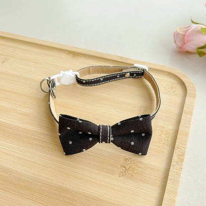 Black polka-dot bow cat collar with buckle and adjustable strap