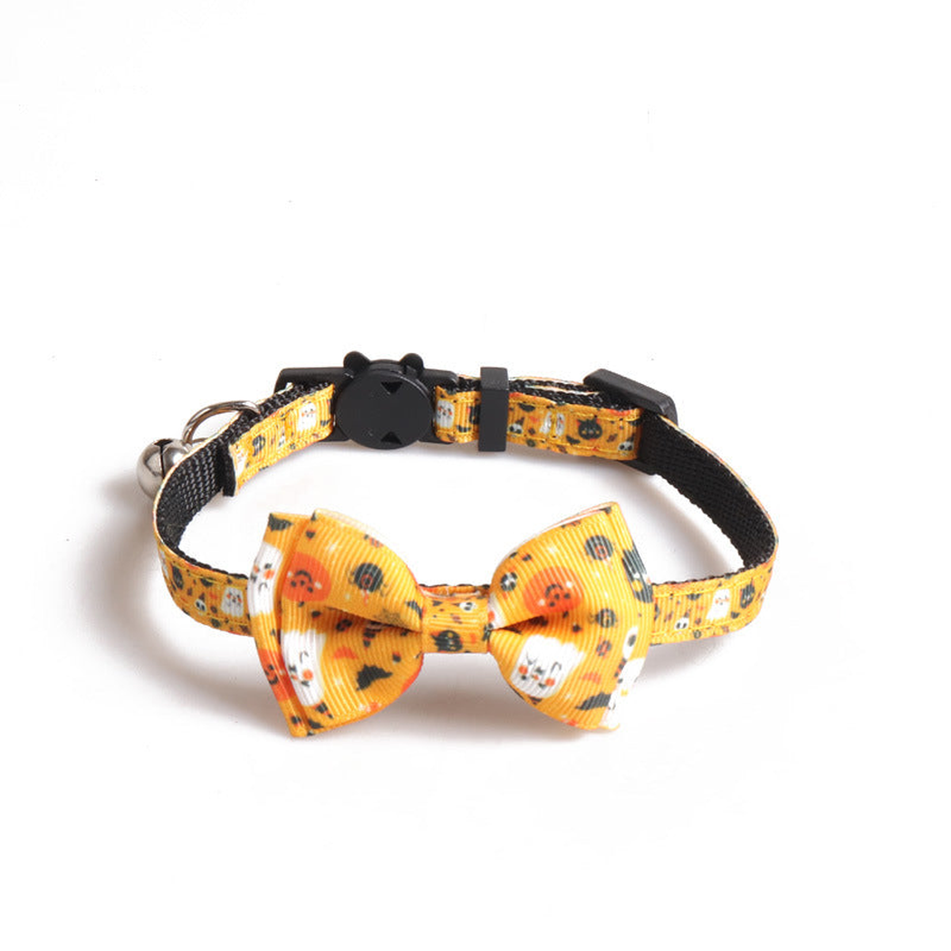 Yellow-orange cat collar with pumpkin-and-ghost print, bow and bell