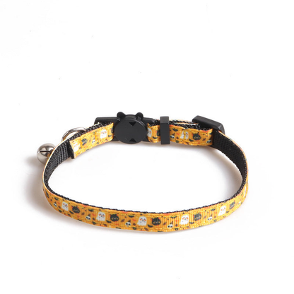 Yellow-orange cat collar with pumpkin-and-ghost print, cat-face clasp and bell