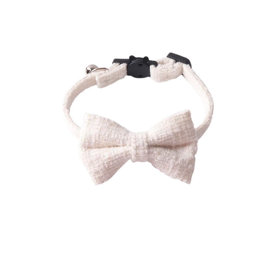 White textured cat collar with bow, bell and cat-face buckle