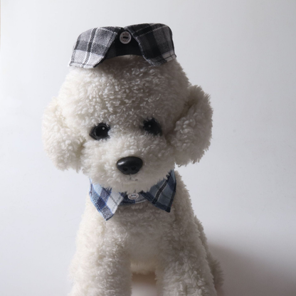 Blue plaid bow collar displayed around the neck of a plush dog model