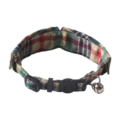 Green plaid cat collar showing the cat-face buckle, adjustment slider and bell