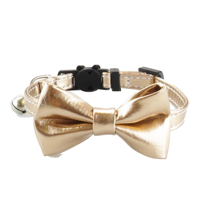 Gold-tone bow cat collar with bell, front view