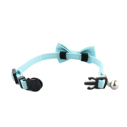 Reverse view of a light blue bow attached to the collar strap