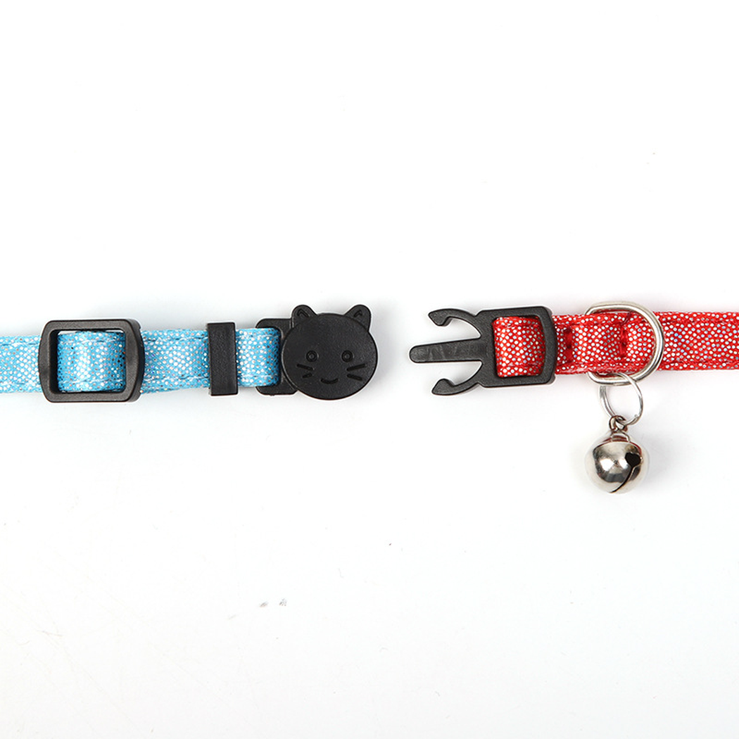 Straight-on detail of the separated cat-face buckle and bell attachment