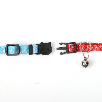 Straight-on detail of the separated cat-face buckle and bell attachment