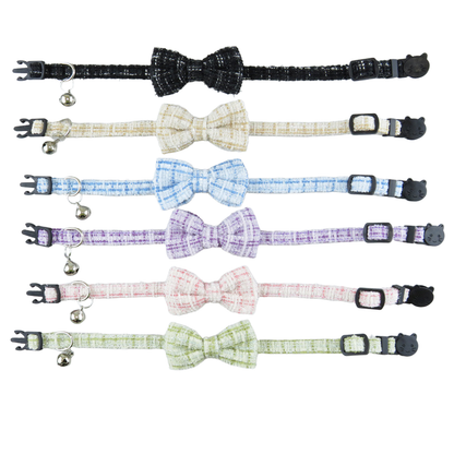 Six textured bow cat collars displayed fully extended in assorted colors
