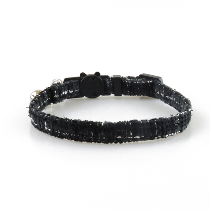 Black textured cat collar without bow, showing the adjustable band