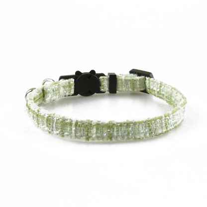 Green textured cat collar without bow, showing the adjustable band