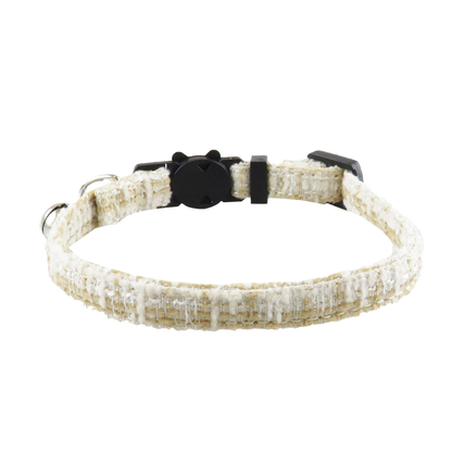 Beige textured cat collar without bow, showing the bell and adjustable band