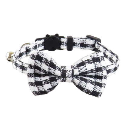 Black and white houndstooth cat collar with matching bow, front view