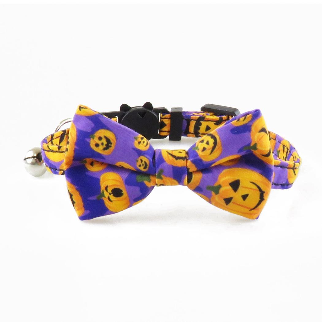 Purple pumpkin-print bow cat collar with bell, front view
