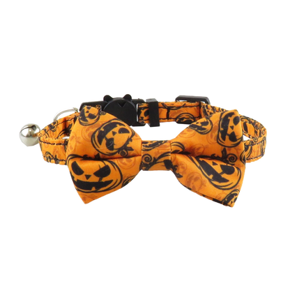 Orange jack-o'-lantern-print bow cat collar with bell, front view