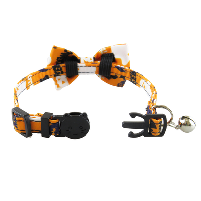 Halloween bow cat collar opened to show the cat-face clasp, slider and bell