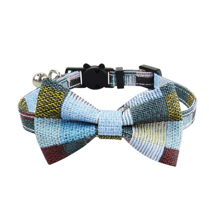 Light blue patchwork cat collar with bow and bell, front view