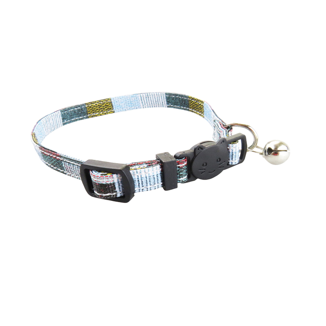 Close-up of a light blue patchwork cat collar with cat-face buckle and bell