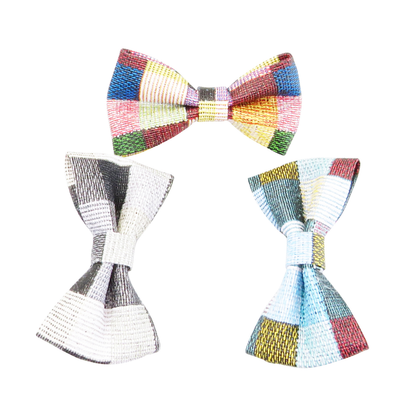 Close-up of three color-block bow designs for the cat collars