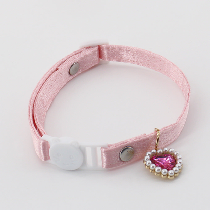 Light pink cat collar with a cat-face buckle and pink heart charm