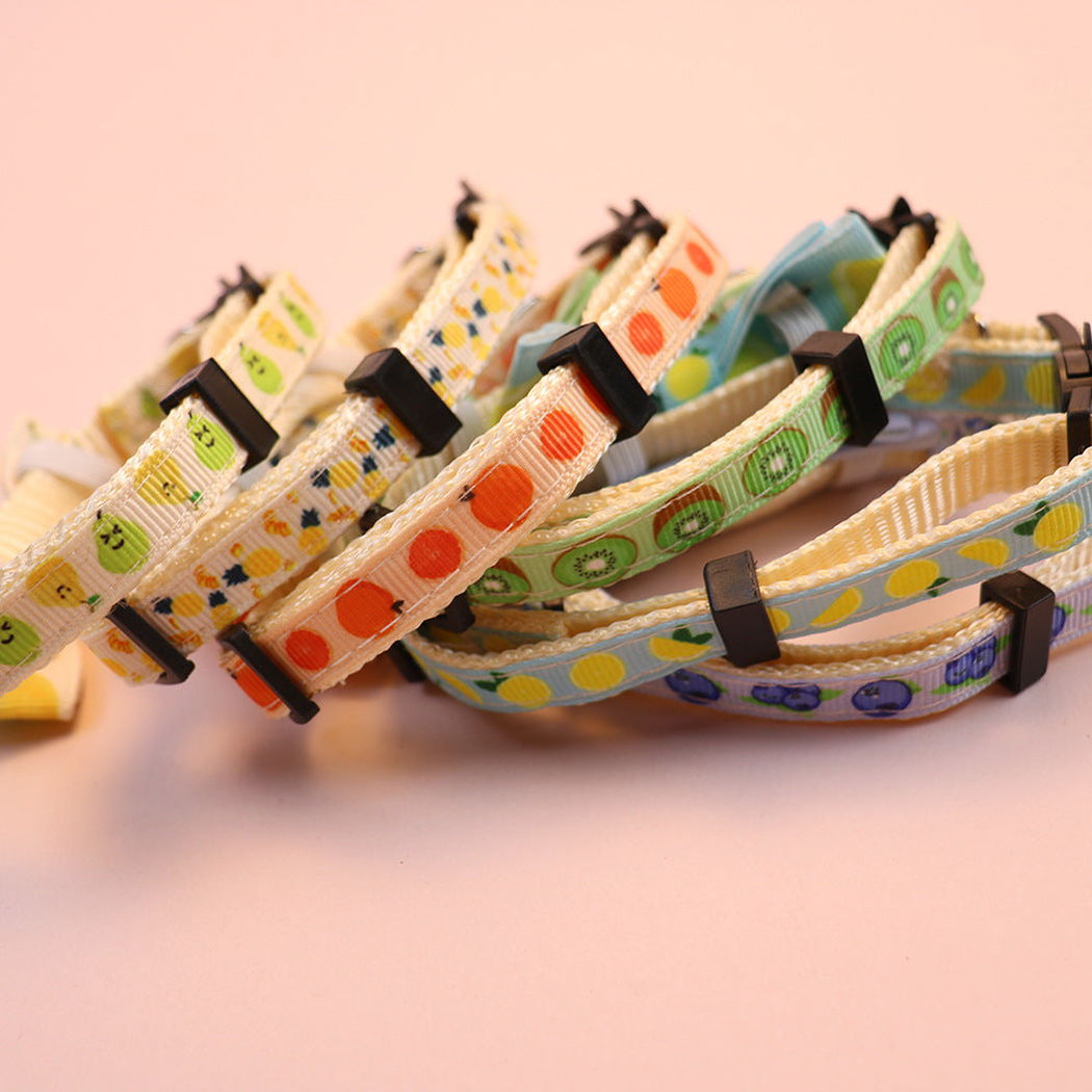 Close-up of printed collar bands with cream edge stitching and adjusters