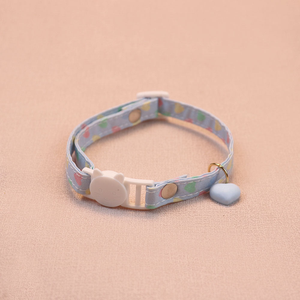 Light blue heart-print cat collar with a blue heart charm and cat-face buckle
