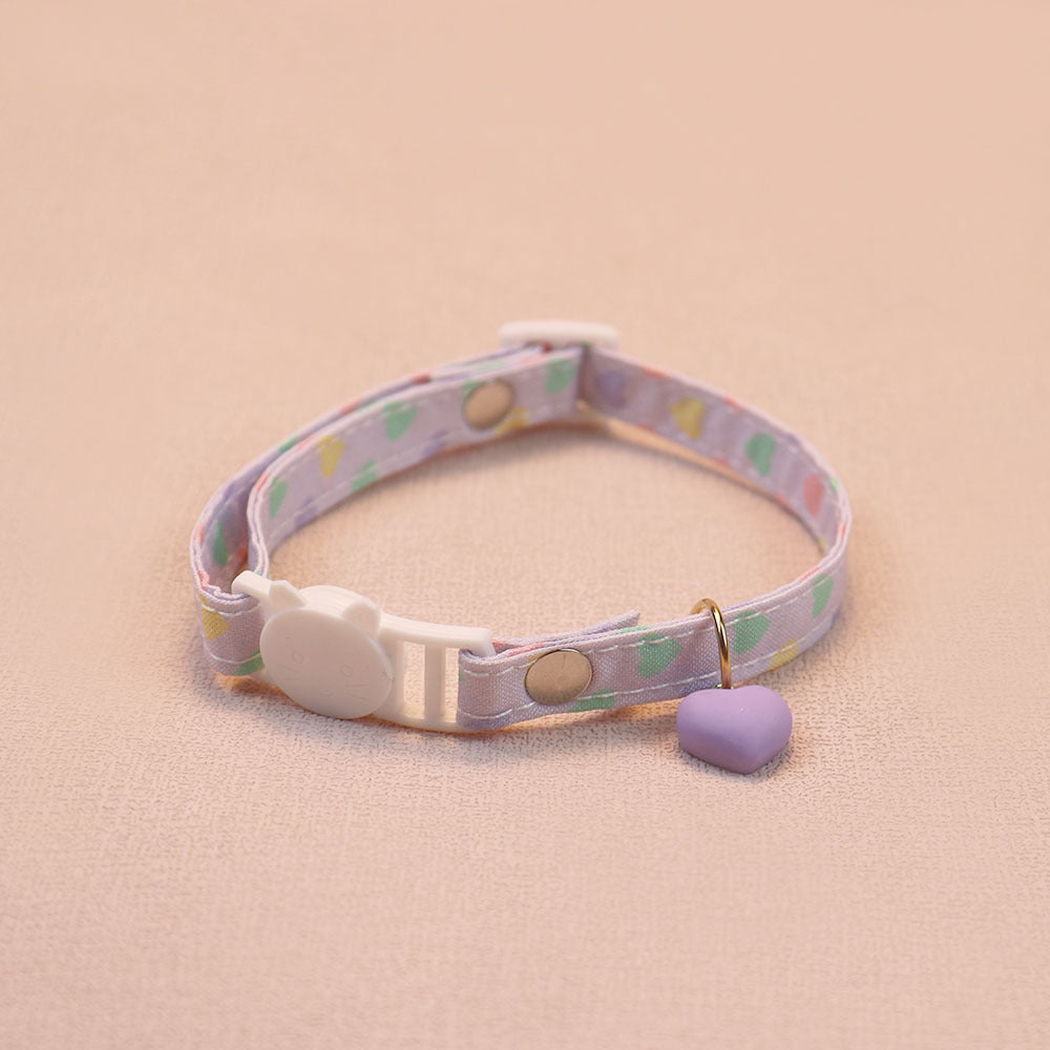 Light purple heart-print cat collar with a purple heart charm and cat-face buckle