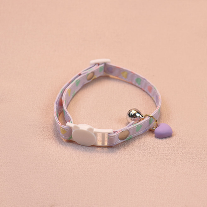 Light purple heart-print cat collar with a purple heart charm, bell and cat-face buckle