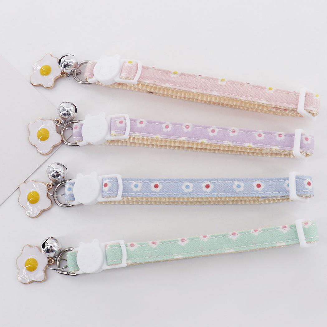 Mint, light blue, light pink and light purple daisy cat collars displayed together