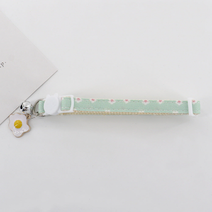 Mint daisy cat collar with cat-face buckle, bell and fried egg charm