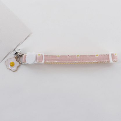 Light pink daisy cat collar with cat-face buckle, bell and fried egg charm