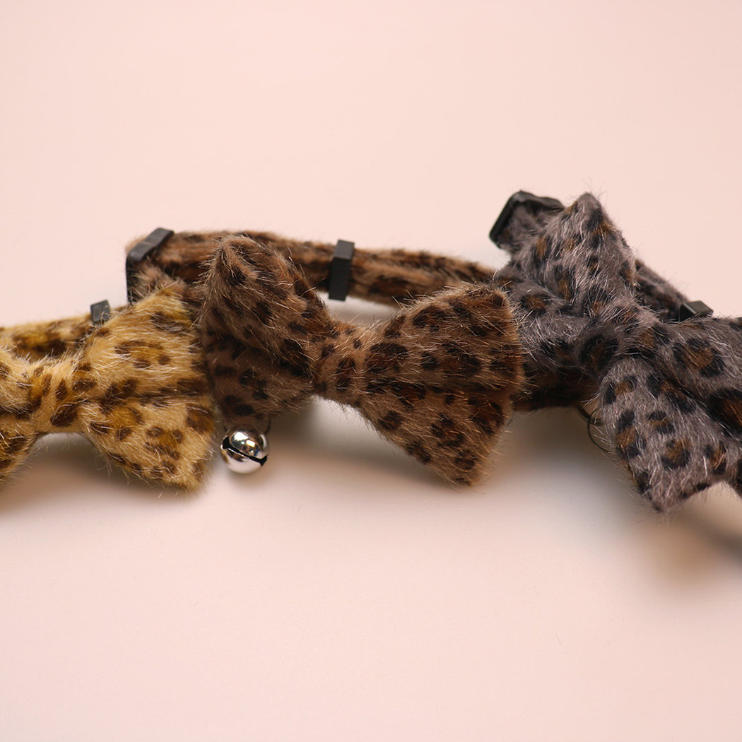 Close-up of khaki, brown and dark gray leopard-print collar bows