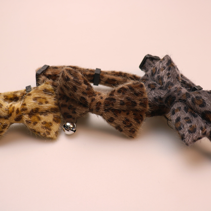 Close-up of khaki, brown and dark gray leopard-print collar bows
