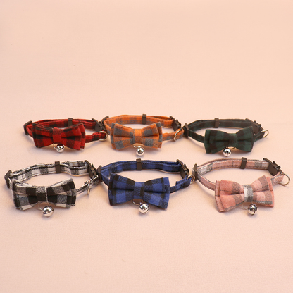 Six plaid bow cat collars with bells arranged in two rows