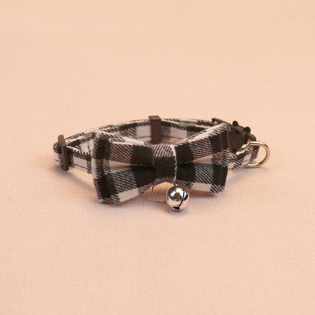Black and white plaid bow cat collar with centered bell