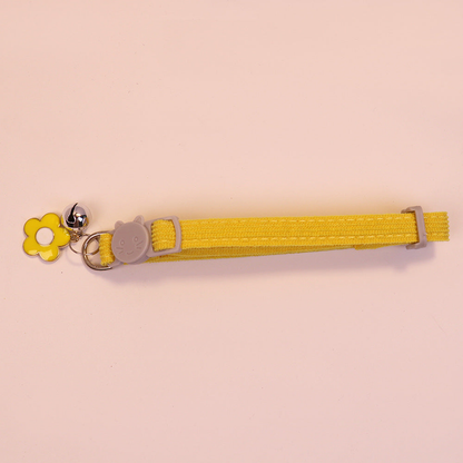 Yellow cat collar with cat-face buckle, yellow flower charm and bell