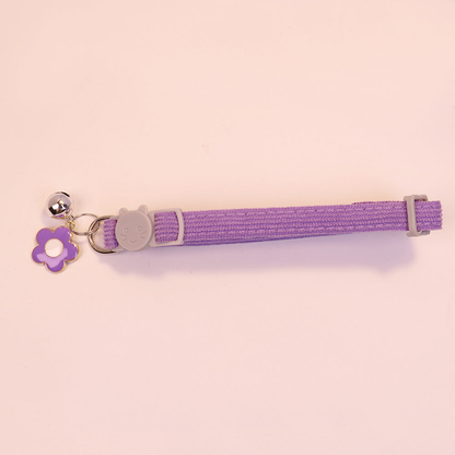 Purple cat collar with cat-face buckle, purple flower charm and bell