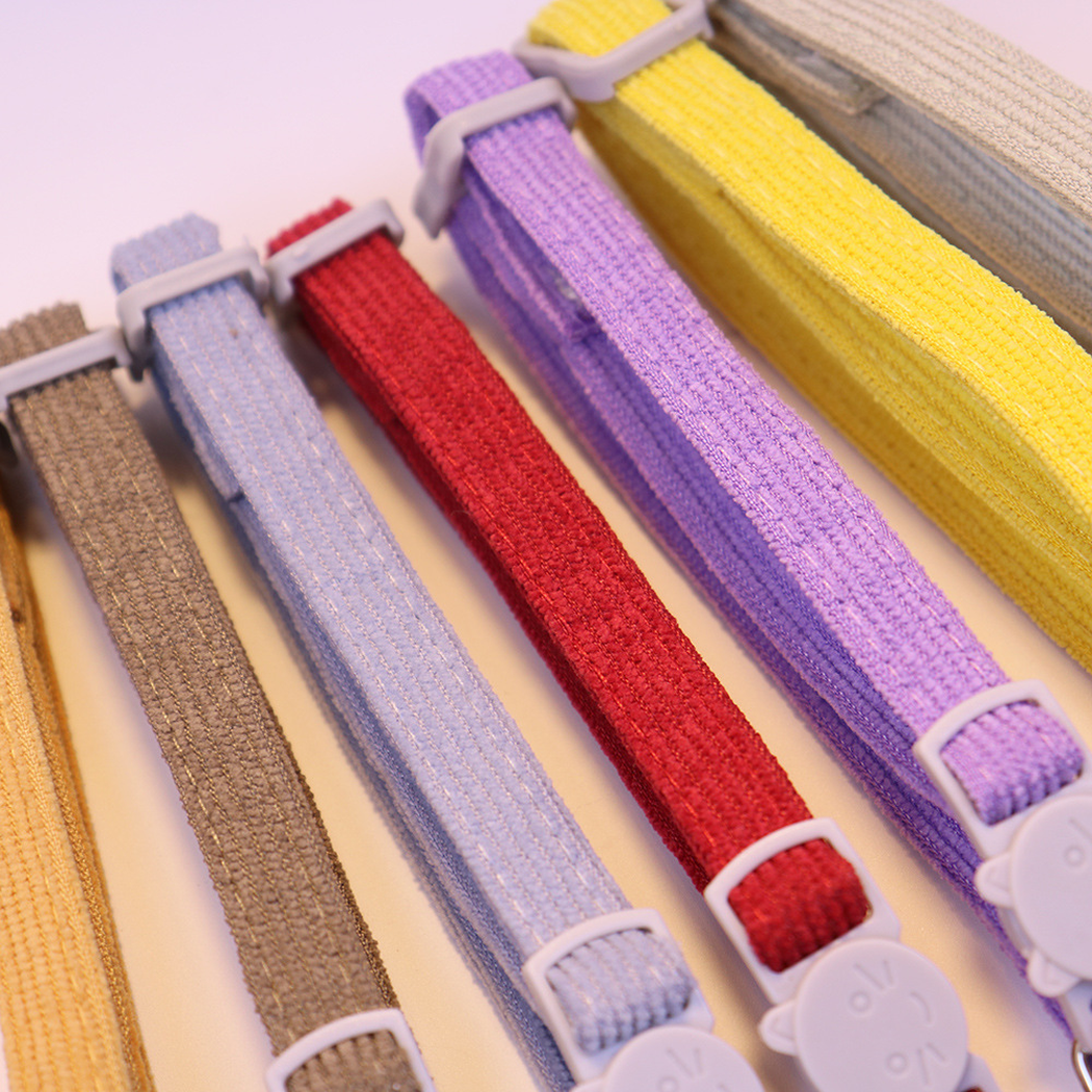 Close-up of ribbed collar straps and adjustable sliders in multiple colors