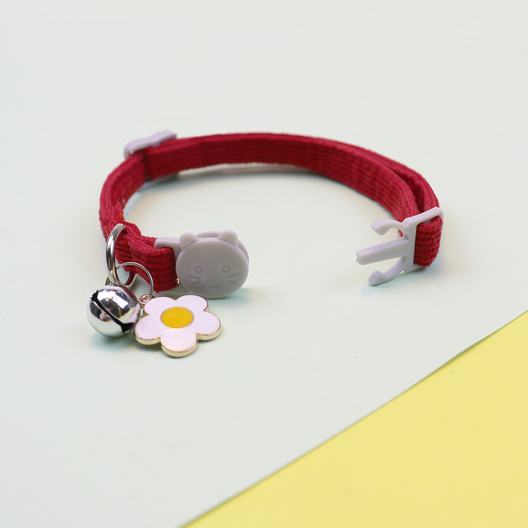 Red cat collar with open cat-face buckle, flower charm and bell
