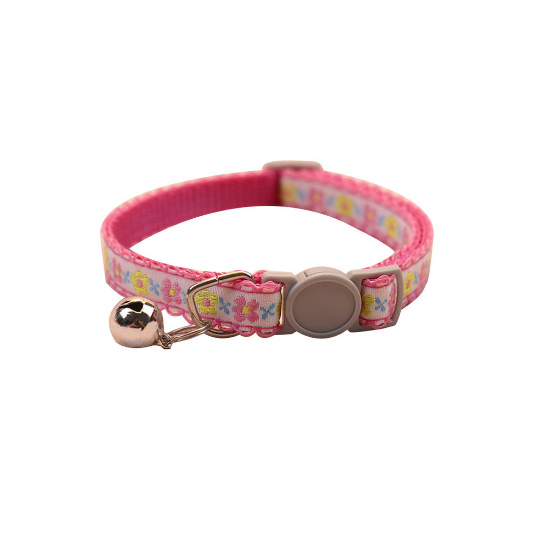 Pink floral cat collar with bell and round buckle on a white background