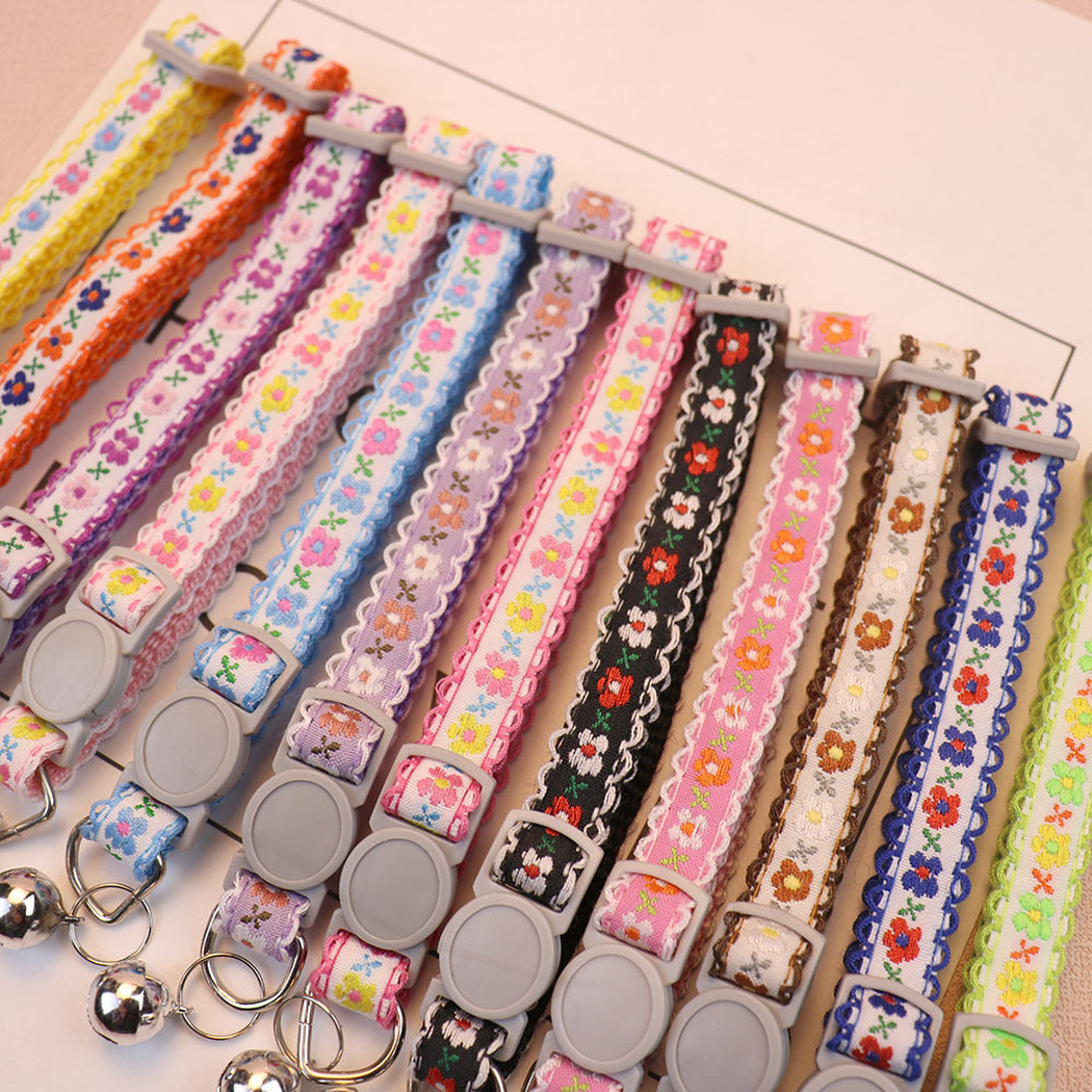 Floral cat collars in assorted colors displayed together