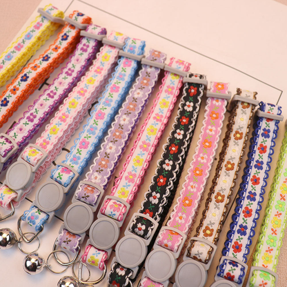 Floral cat collars in assorted colors displayed together