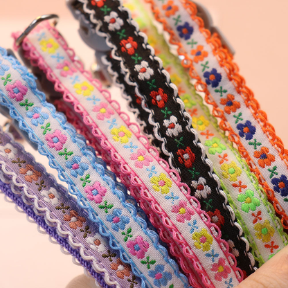 Close-up of floral collar bands with contrast scalloped trim