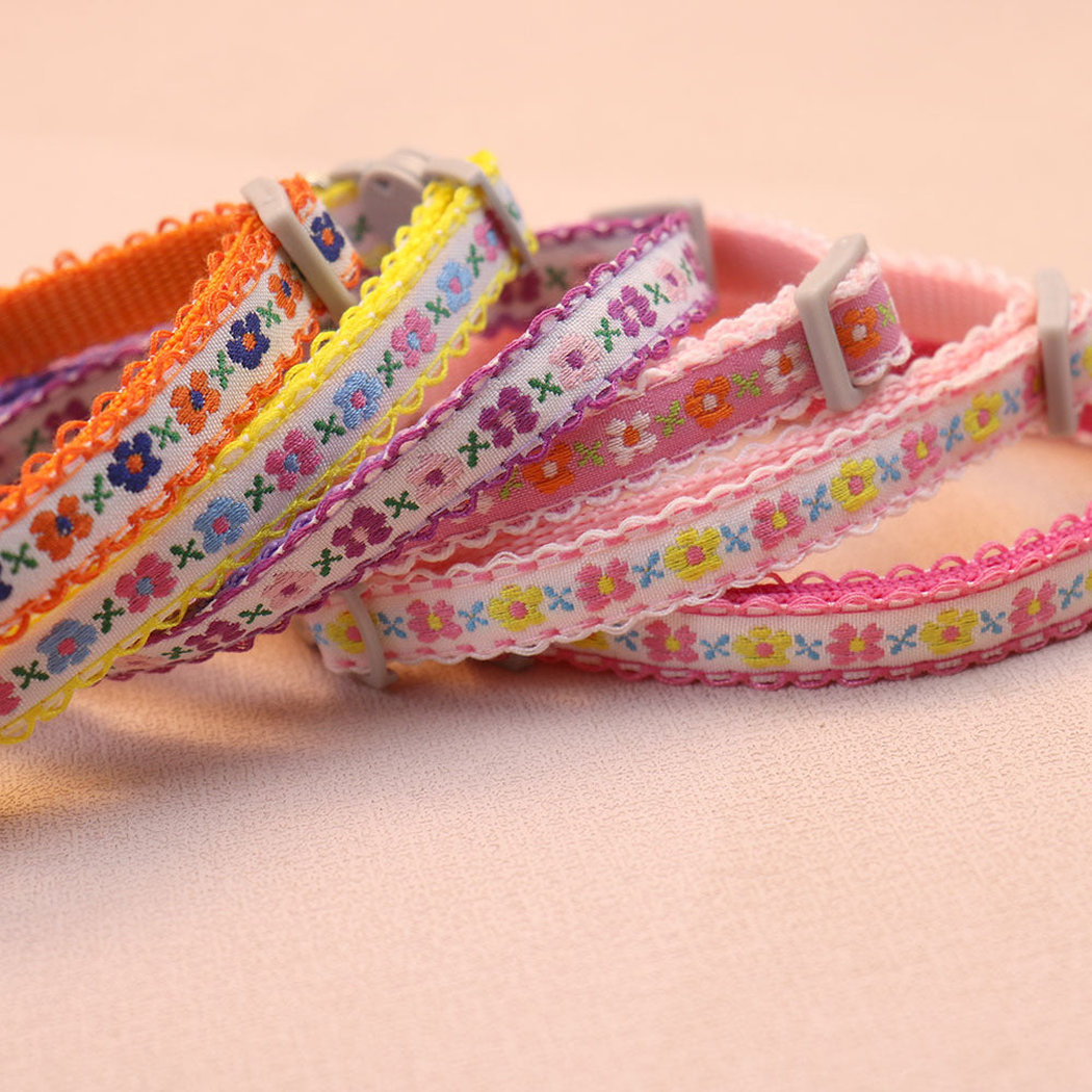 Close-up of assorted floral collar straps and sliding adjusters