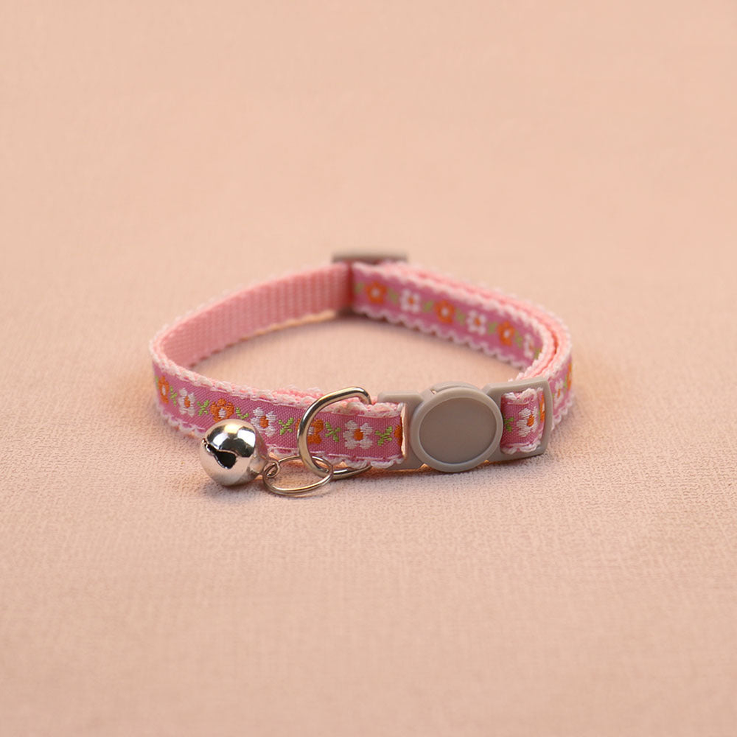 Pink floral cat collar with pale trim, bell and round buckle