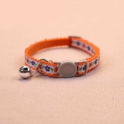 Orange floral cat collar with bell and round buckle