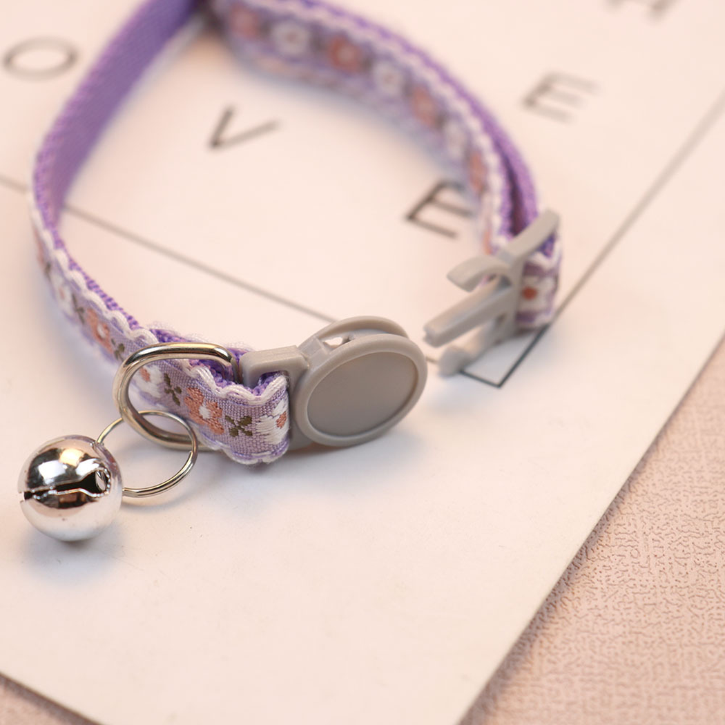 Close-up of the separated two-piece collar buckle and bell rings