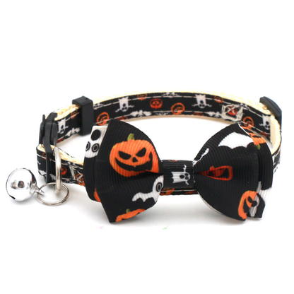 Black cat collar with large pumpkin and ghost-print bow and bell