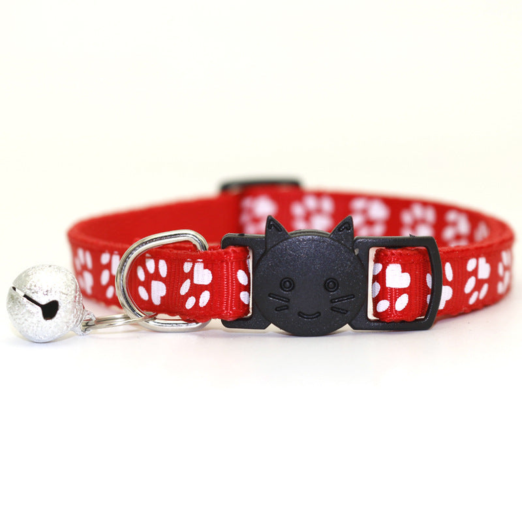 Red paw-print cat collar with cat-face buckle and bell