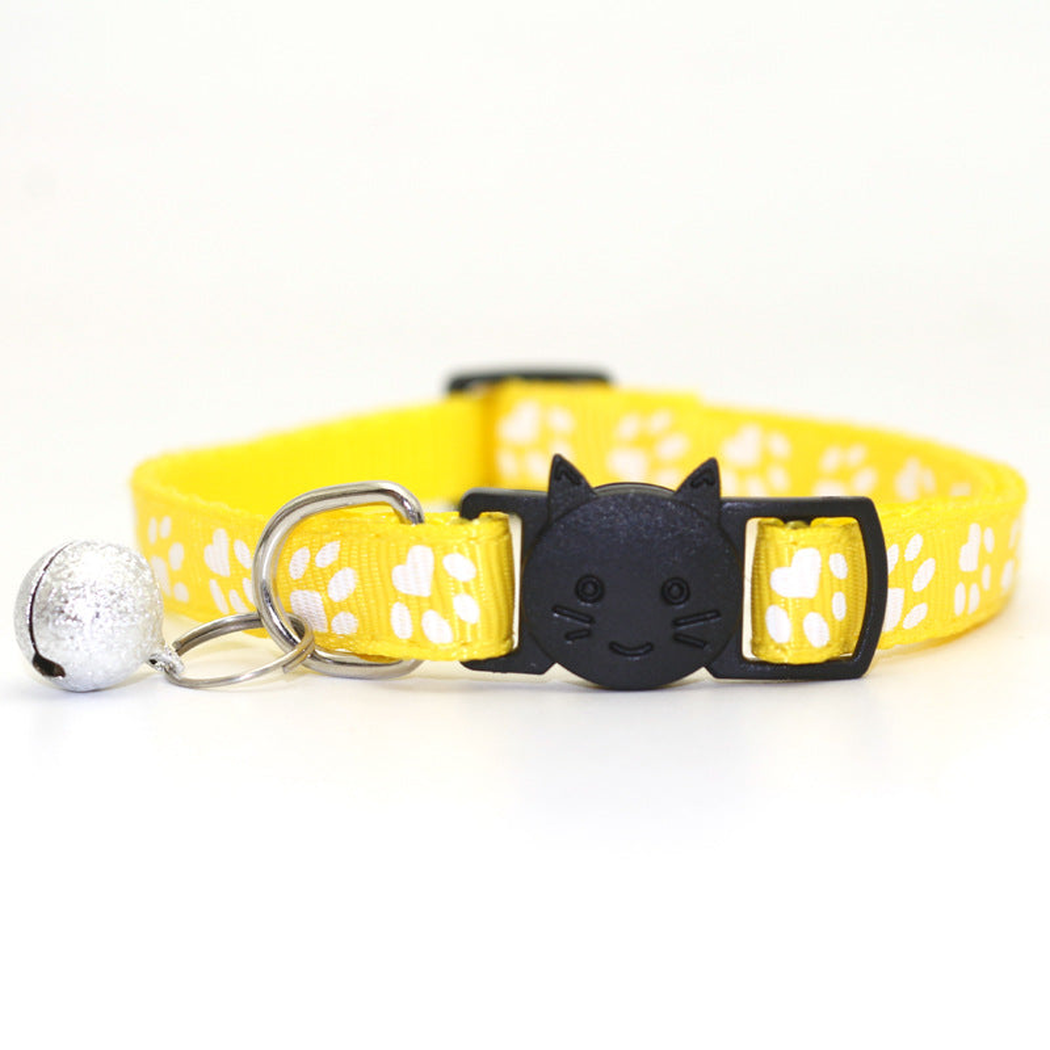 Yellow paw-print cat collar with cat-face buckle and bell