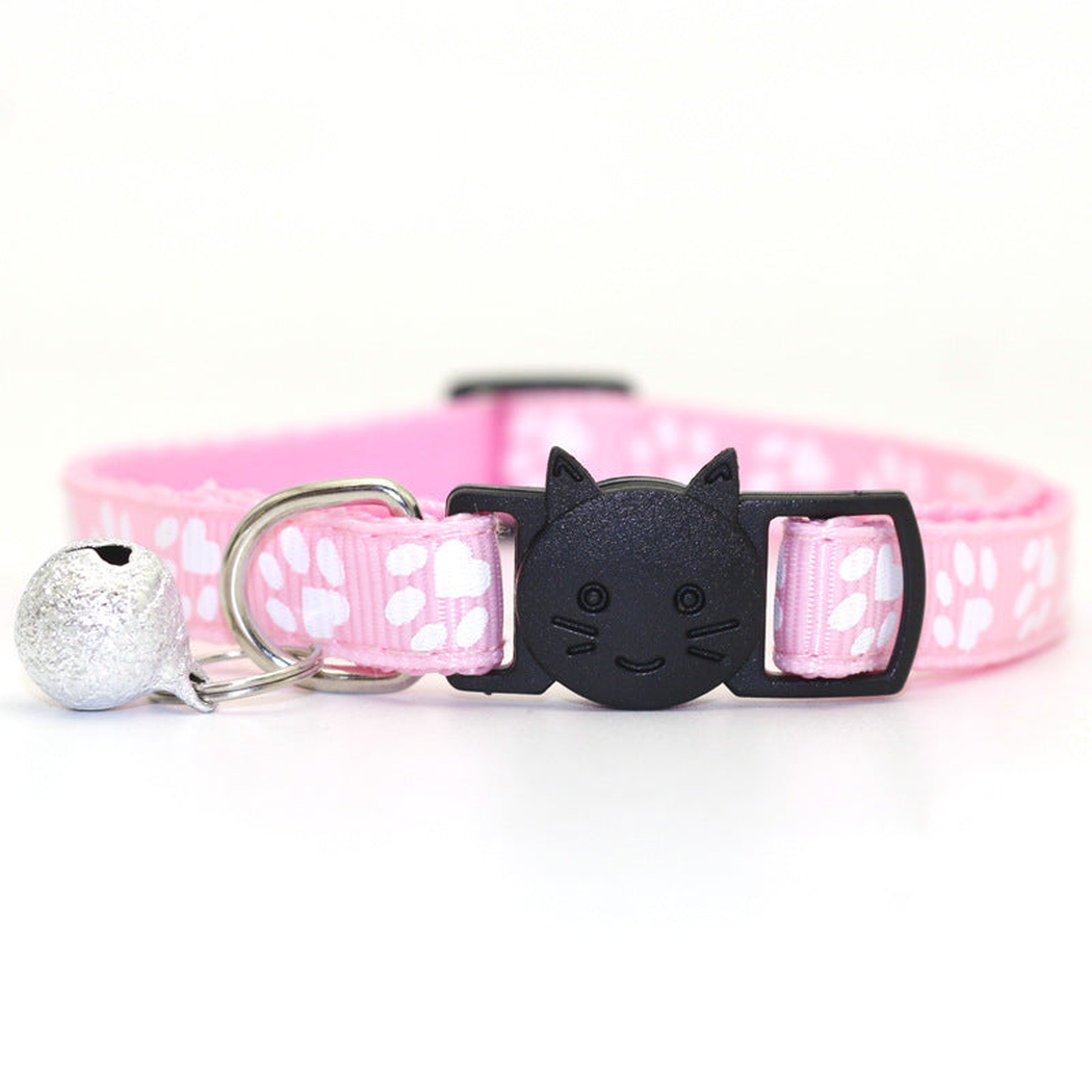 Light pink paw-print cat collar with cat-face buckle and bell