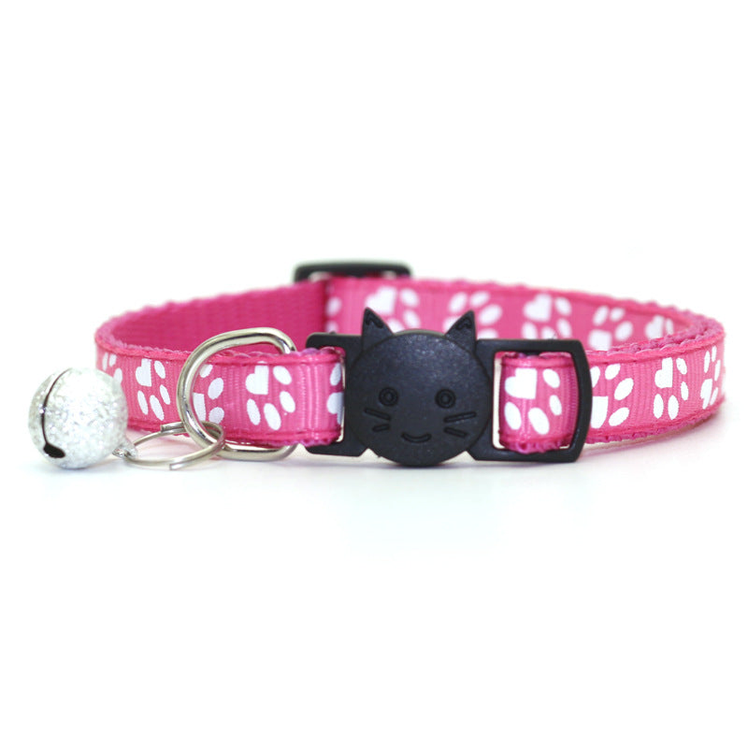 Fuchsia paw-print cat collar with cat-face buckle and bell